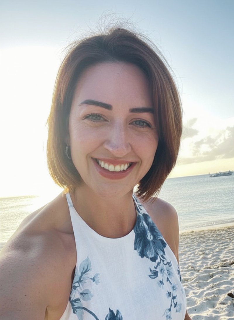 Tiffany smiling on the beach at sunset